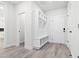 Well-organized mudroom with built-in storage and durable wood-look flooring at 113 Pueblo Dr, Louisburg, NC 27549
