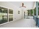 Covered back porch with ceiling fan, outdoor lighting, and backyard views at 113 Pueblo Dr, Louisburg, NC 27549