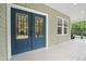 Inviting porch with double-door entry boasts ample space and scenic views at 113 Pueblo Dr, Louisburg, NC 27549