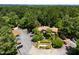 Beautiful aerial view of townhomes with lush landscaping and plenty of parking at 113 Twisted Oak Pl, Durham, NC 27705
