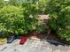 An aerial view of a building surrounded by green trees and a parking lot at 113 Twisted Oak Pl, Durham, NC 27705