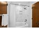 The bathroom features a shower with white tiles, a shower head, and a stylish towel rack at 113 Twisted Oak Pl, Durham, NC 27705