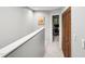 Hallway with neutral paint, light carpeting, and a closet at 113 Twisted Oak Pl, Durham, NC 27705