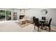 Cozy living room with fireplace, soft carpet, and natural lighting at 113 Twisted Oak Pl, Durham, NC 27705