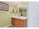 Bright bathroom with vanity with sink and a large mirror at 1205 Magnolia Hill Rd, Garner, NC 27529