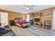 Bright bedroom featuring orange walls and a ceiling fan with recessed lights at 1205 Magnolia Hill Rd, Garner, NC 27529