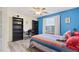 Comfortable bedroom with brightly painted walls and a light ceiling fan at 1205 Magnolia Hill Rd, Garner, NC 27529