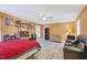 Bedroom with neutral walls, ceiling fan, hardwood floors and multiple seating options and windows for light at 1205 Magnolia Hill Rd, Garner, NC 27529