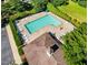 Aerial view of a large community pool with many lounge chairs surrounding it at 1205 Magnolia Hill Rd, Garner, NC 27529