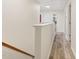 Upstairs hallway with doors leading to several rooms at 1205 Magnolia Hill Rd, Garner, NC 27529