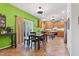 Spacious kitchen and dining area featuring hardwood floors, abundant counter space, and sliding glass doors to the exterior at 1205 Magnolia Hill Rd, Garner, NC 27529