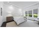 Serene bedroom with tray ceiling, neutral color palette, and large windows at 129 Damsire Way, Cary, NC 27513