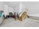 Spacious garage with storage racks, refrigerator, and stairs to upper level at 129 Damsire Way, Cary, NC 27513