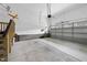 Clean and spacious garage with epoxy flooring and an automatic door at 129 Damsire Way, Cary, NC 27513