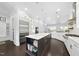 Modern kitchen featuring a center island, stainless steel appliances, and ample storage at 129 Damsire Way, Cary, NC 27513