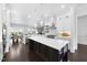 Bright kitchen with a marble topped island, stainless steel appliances and open layout at 129 Damsire Way, Cary, NC 27513