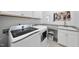 Modern laundry room with new appliances and neutral colors at 129 Damsire Way, Cary, NC 27513