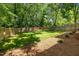 Spacious backyard features a well-maintained lawn and a wooden privacy fence, perfect for outdoor enjoyment at 1317 Fay St, Durham, NC 27701