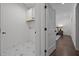 Bright laundry area features stylish tile flooring, storage cabinets and laundry machines hookups at 1317 Fay St, Durham, NC 27701