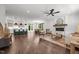 Open-concept living room featuring a fireplace, hardwood floors, and seamless flow to the kitchen at 1317 Fay St, Durham, NC 27701