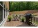 Back deck features a grill, outdoor seating, and tranquil views of the surrounding landscape at 1344 Legend Oaks Dr, Chapel Hill, NC 27517