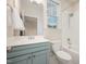 Bright bathroom with a blue vanity, white countertop, and a tiled shower/tub combination at 1344 Legend Oaks Dr, Chapel Hill, NC 27517