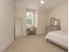 Neutral bedroom with a desk, dresser, and comfortable carpet at 1344 Legend Oaks Dr, Chapel Hill, NC 27517