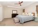 Cozy bedroom with ceiling fan, large windows, and neutral decor at 1344 Legend Oaks Dr, Chapel Hill, NC 27517