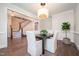 Chic dining room with modern lighting, a wooden table, and a view of the home's staircase at 1344 Legend Oaks Dr, Chapel Hill, NC 27517