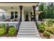 Inviting front porch with rocking chairs, stylish décor, and access to a well-designed entrance at 1344 Legend Oaks Dr, Chapel Hill, NC 27517