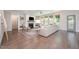 Bright living room features hardwood floors, a cozy fireplace, and large windows at 1344 Legend Oaks Dr, Chapel Hill, NC 27517