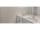 Bright bathroom featuring double sinks, a large mirror and neutral walls at 136 Pisgah St, Sanford, NC 27330