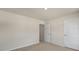 Bedroom with neutral walls, carpet flooring and white doors at 136 Pisgah St, Sanford, NC 27330