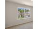 Bedroom featuring a double window overlooking a tree lined backyard at 136 Pisgah St, Sanford, NC 27330