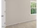Comfortable bedroom featuring a window and neutral carpeting for a cozy feel at 136 Pisgah St, Sanford, NC 27330