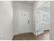 Bright foyer with white door, hardwood floors, and glass-paneled door leading to another room at 136 Pisgah St, Sanford, NC 27330