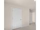 Hallway featuring a white paneled door leading into another room at 136 Pisgah St, Sanford, NC 27330