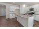 Modern kitchen with white cabinets, stainless steel appliances, and granite countertops at 136 Pisgah St, Sanford, NC 27330