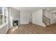 Spacious living room features hard surface floors, a fireplace, and an open staircase at 136 Pisgah St, Sanford, NC 27330