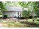 Backyard with a wooden deck and mature trees at 140 Baron Cir, Youngsville, NC 27596