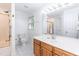 Bright bathroom with a single sink vanity, large mirror, and shower and tub combo at 140 Baron Cir, Youngsville, NC 27596