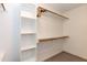 Walk-in closet featuring built-in shelving and ample storage space at 140 Baron Cir, Youngsville, NC 27596