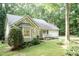 Charming single-story home with stone accents, manicured landscaping, and a welcoming front porch area at 140 Baron Cir, Youngsville, NC 27596
