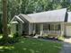 Charming home featuring a covered porch and landscaped front yard at 140 Baron Cir, Youngsville, NC 27596
