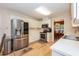 Bright eat-in kitchen with stainless steel appliances, including a large refrigerator, and plenty of cabinet storage space at 140 Baron Cir, Youngsville, NC 27596