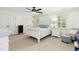 A light and airy bedroom with white walls, carpet, furniture, and a ceiling fan at 142 Scarlet Oak Run, Clayton, NC 27520