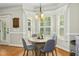 Inviting breakfast nook with bright windows and a stylish chandelier at 142 Scarlet Oak Run, Clayton, NC 27520
