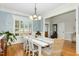 Charming dining room with elegant table and chairs near the entryway at 142 Scarlet Oak Run, Clayton, NC 27520