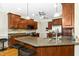 Spacious kitchen with granite countertops, stainless steel appliances, and ample cabinetry at 142 Scarlet Oak Run, Clayton, NC 27520