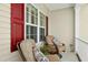 Relaxing front porch with comfortable seating and views of the surrounding landscape at 142 Scarlet Oak Run, Clayton, NC 27520